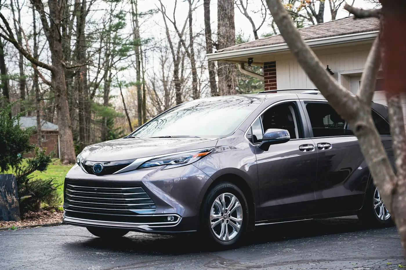 Grey minivan in a driveway