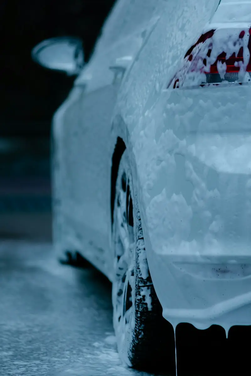Foam running down the side of a white car